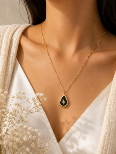18K gold plated pendant, stainless steel teardrop design with a sparkling star pendent.